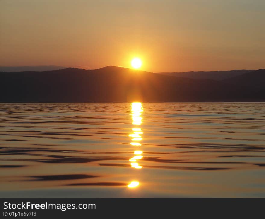 The sun leaves on the West in July evening. The sun leaves on the West in July evening