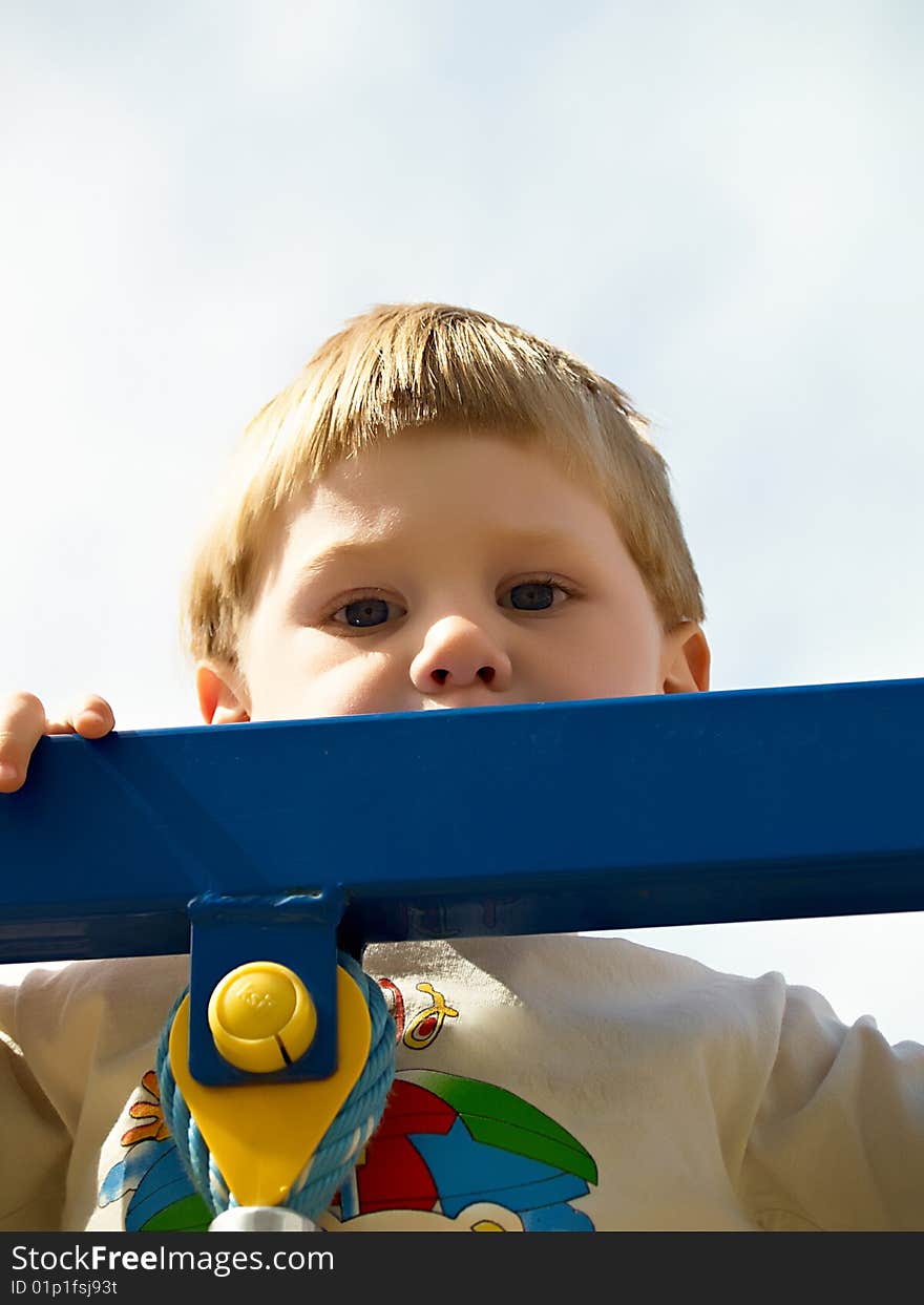 The boy plays in the street