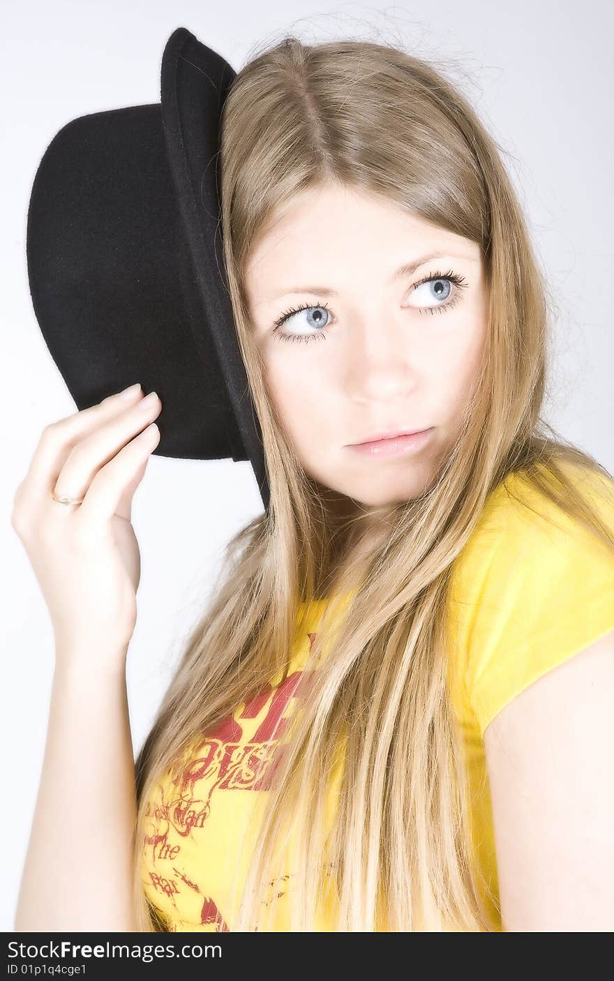 Young blond woman in a hat