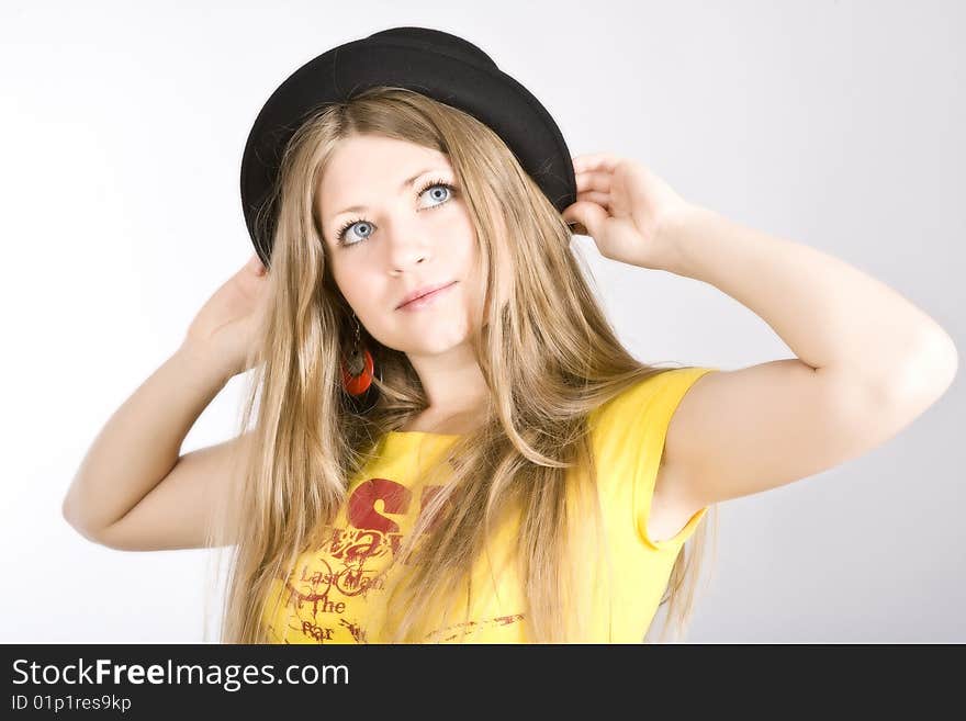 Young blond woman in a hat