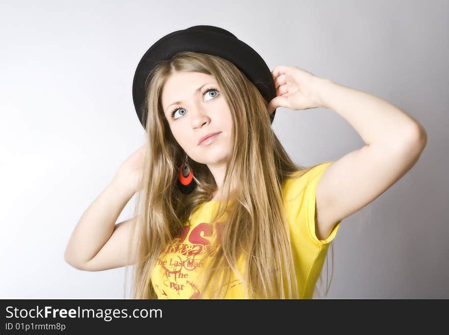 Young blond woman in a hat