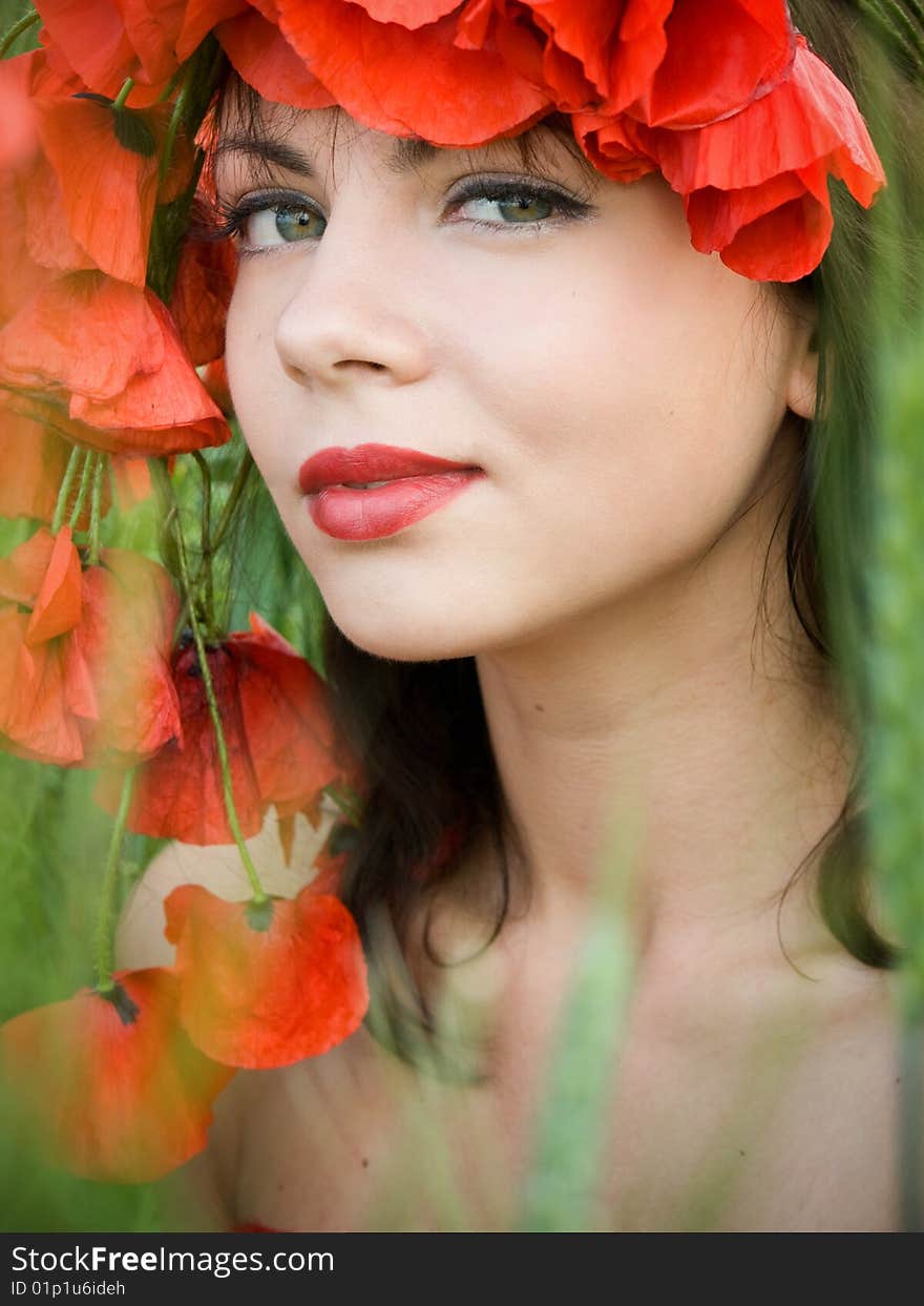 Portrait of beautiful girl in poppies crown. Portrait of beautiful girl in poppies crown