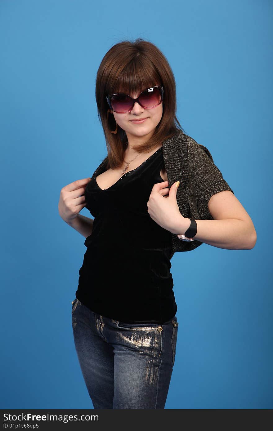 The young girl on a blue background. The young girl on a blue background