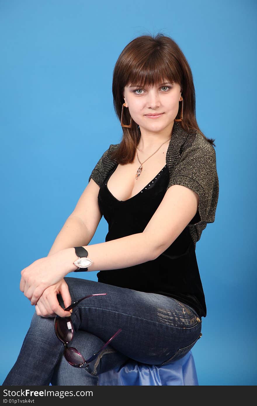 The young girl on a blue background. The young girl on a blue background