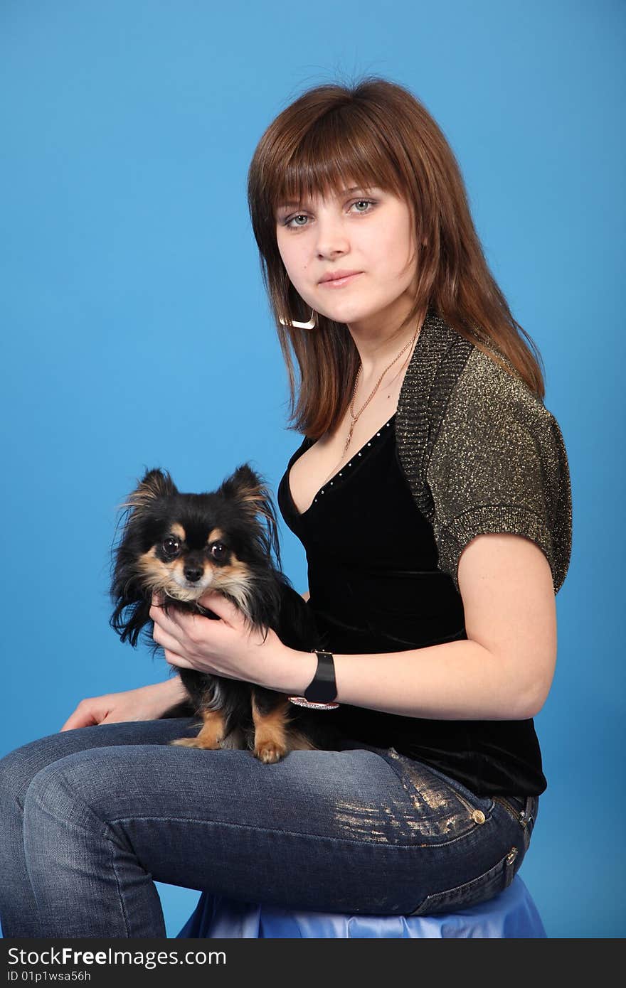 The Girl With The Doggie On A Blue Background