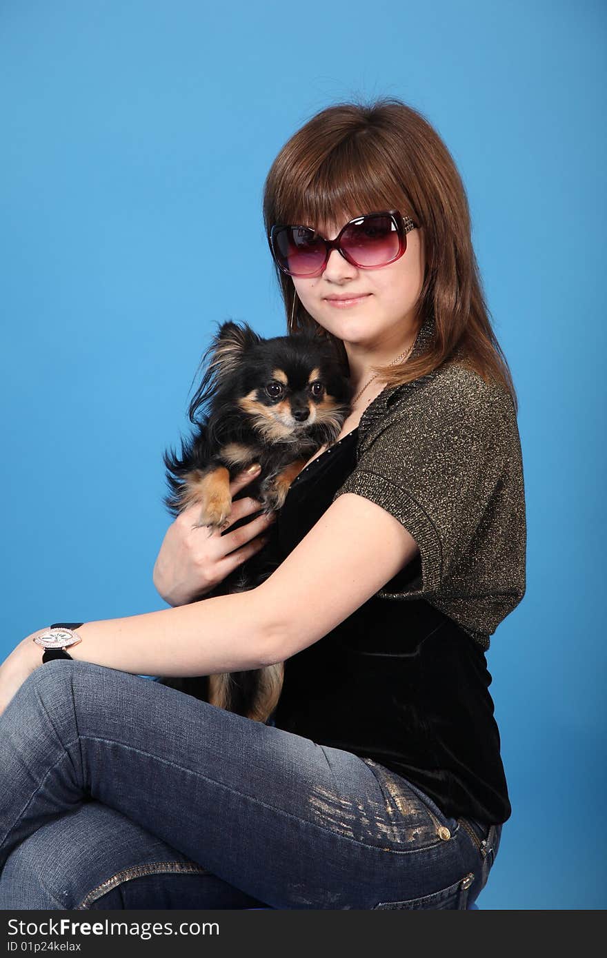 The girl with the doggie on a blue background