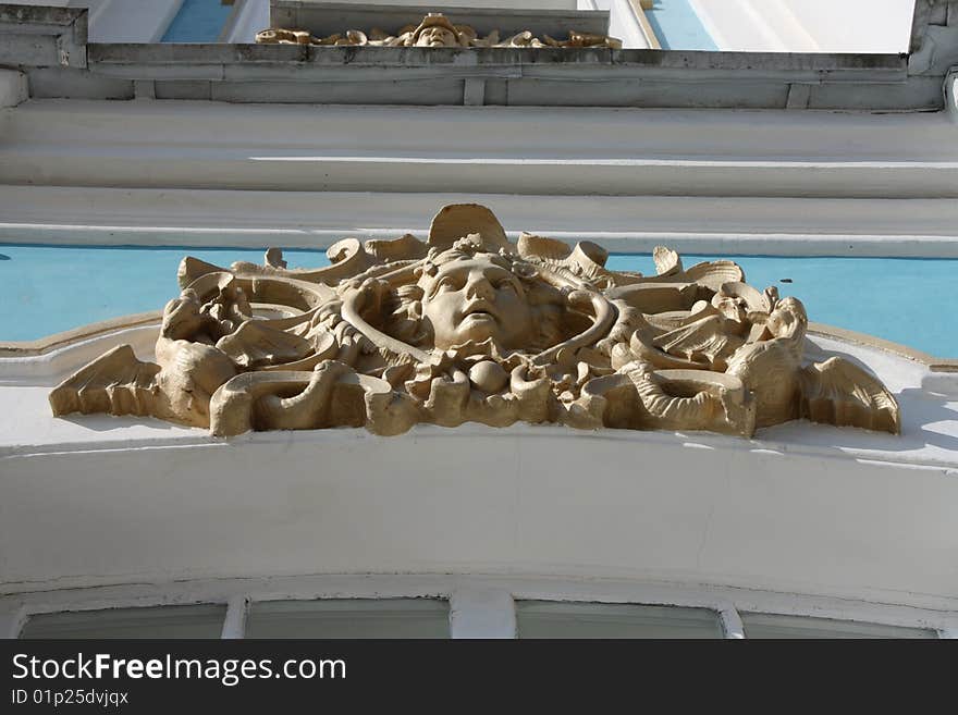 Mask as a decorative detail of the relief. Mask as a decorative detail of the relief