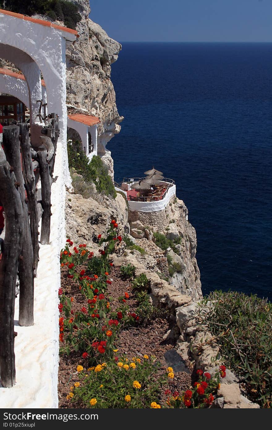 Perspective to the terraces on a cliff above the Mediterranean sea in Balearics