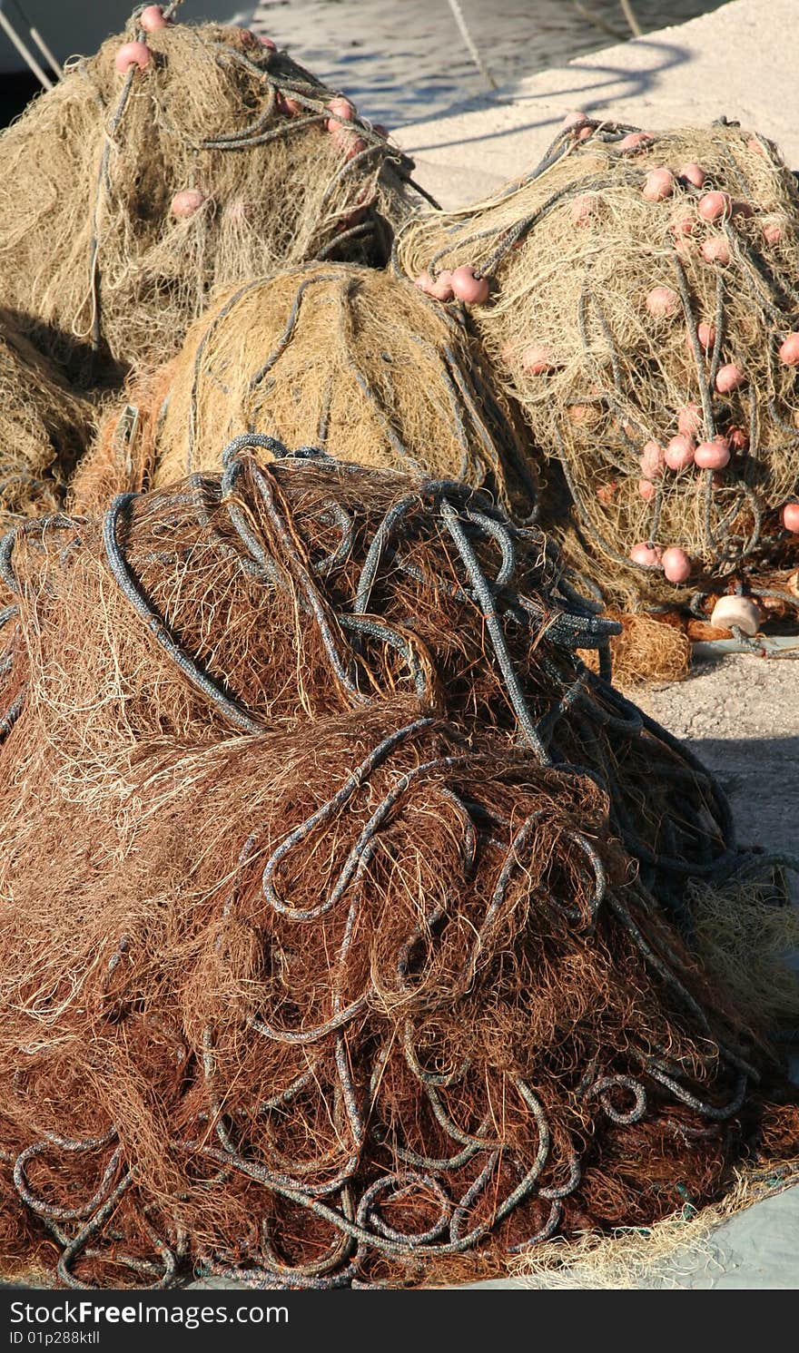 Heaped fishing nets prepared on a coast in Adriatic sea