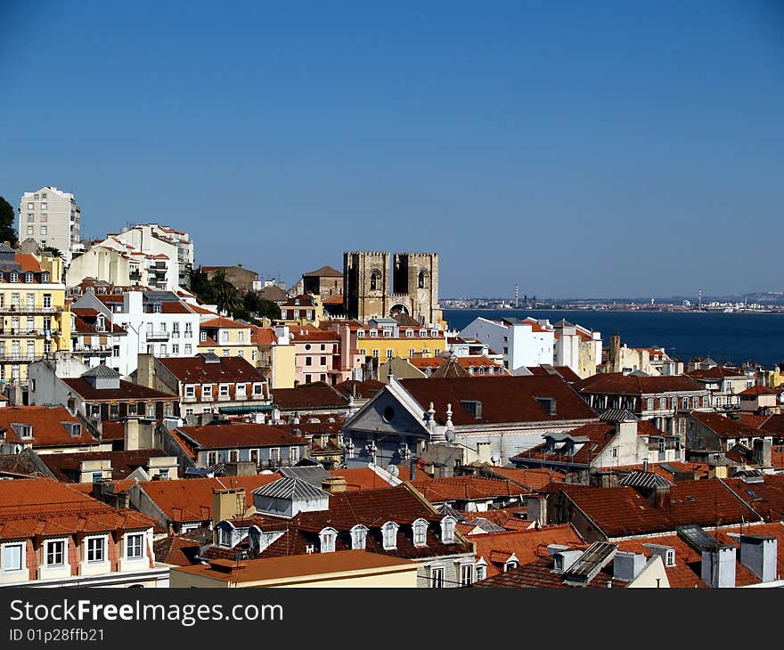 View if rooftops of old Lisbon in the summer. View if rooftops of old Lisbon in the summer.