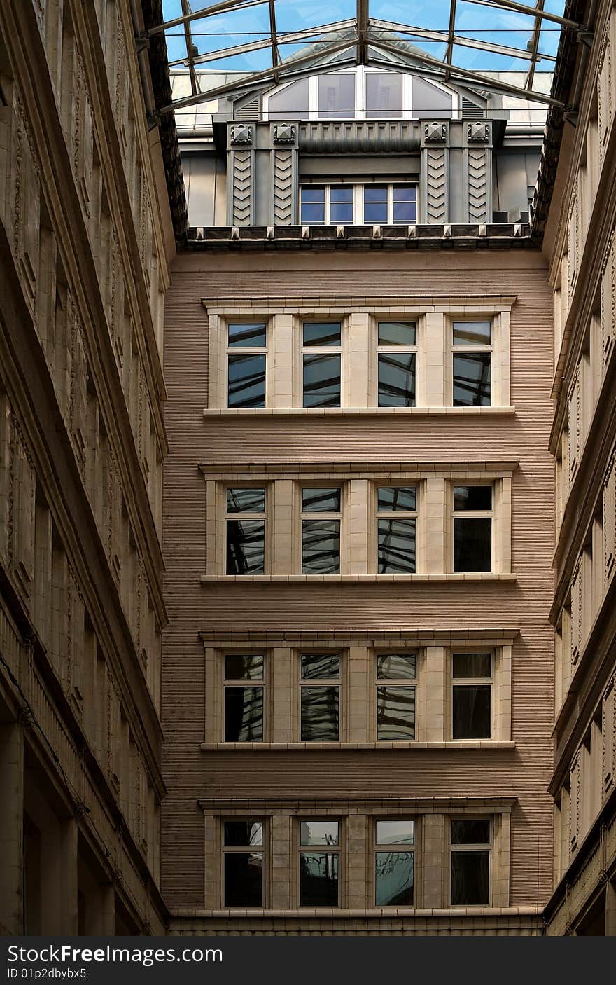 Passage, glass roof over old building yard