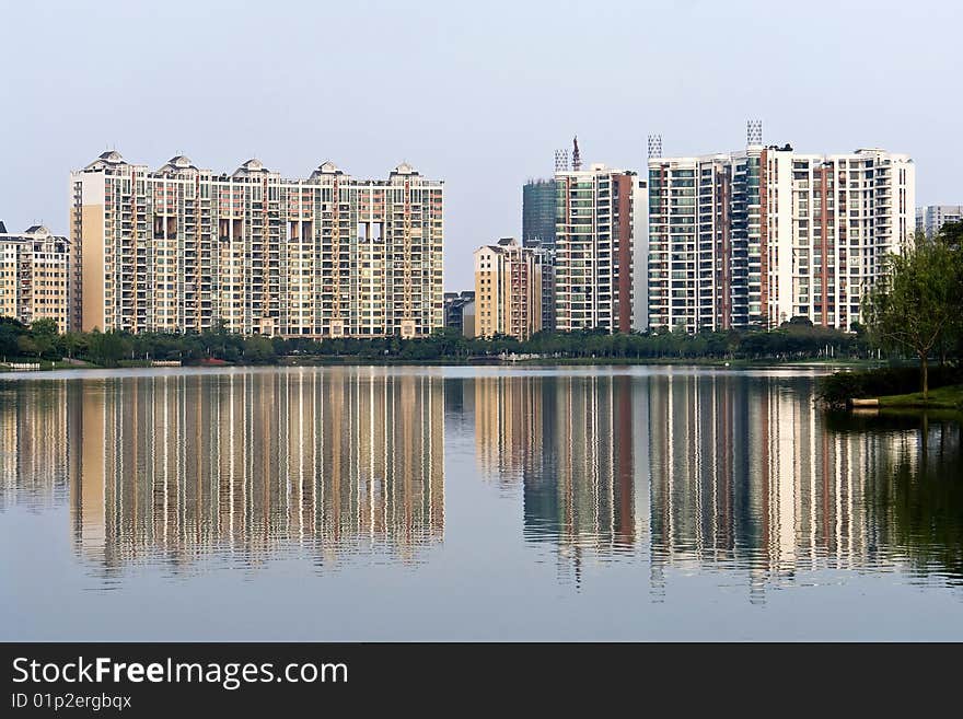 Chinese peaceful community with some modern buildings beside the lake. Chinese peaceful community with some modern buildings beside the lake