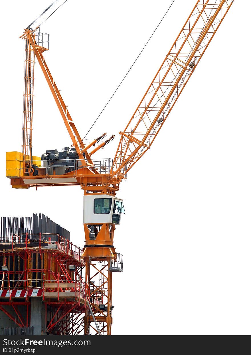 Side view of a tower crane at a construction site. Side view of a tower crane at a construction site