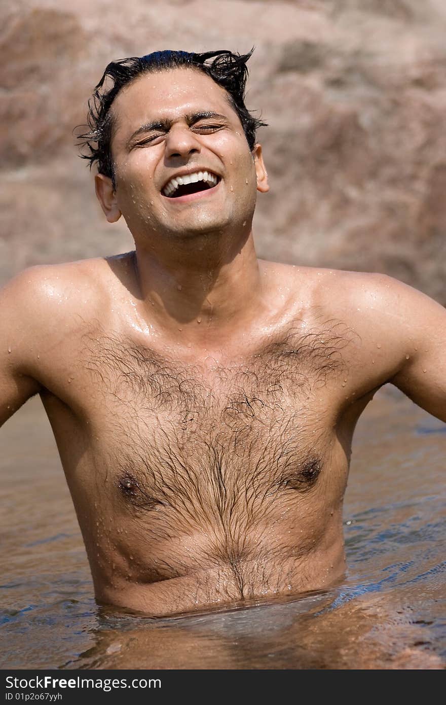 Happy young man enjoying and relaxing  on the river. Happy young man enjoying and relaxing  on the river