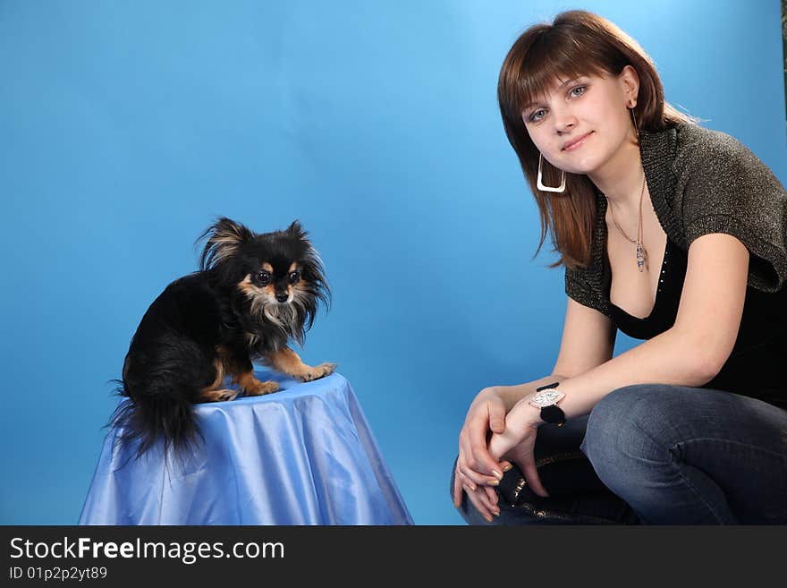 The Girl With The Doggie On A Blue Background