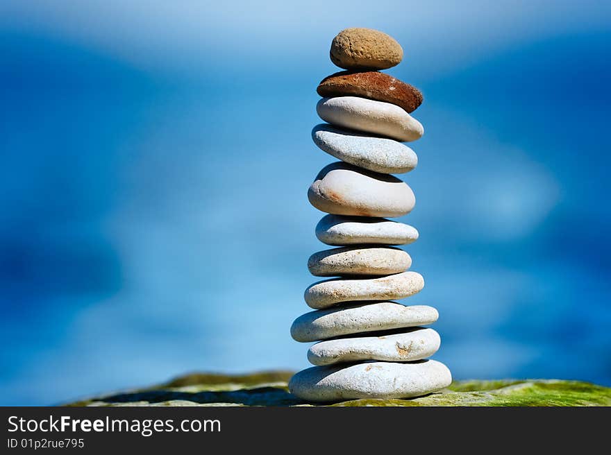 Two red pebbles on top of white pile. Two red pebbles on top of white pile