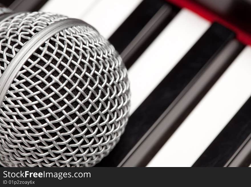 Microphone Laying On Electronic Keyboard