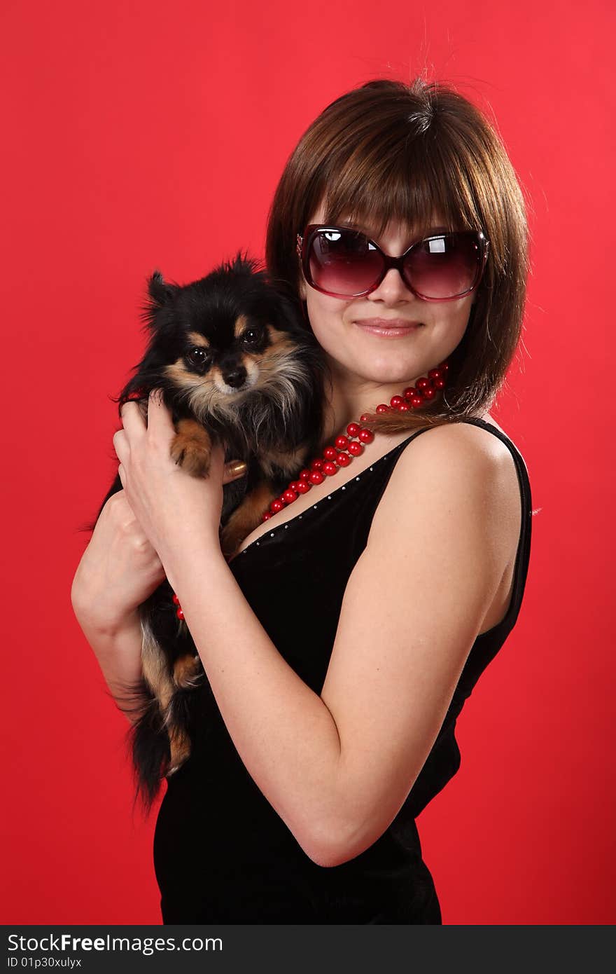 The young girl on a red background. The young girl on a red background