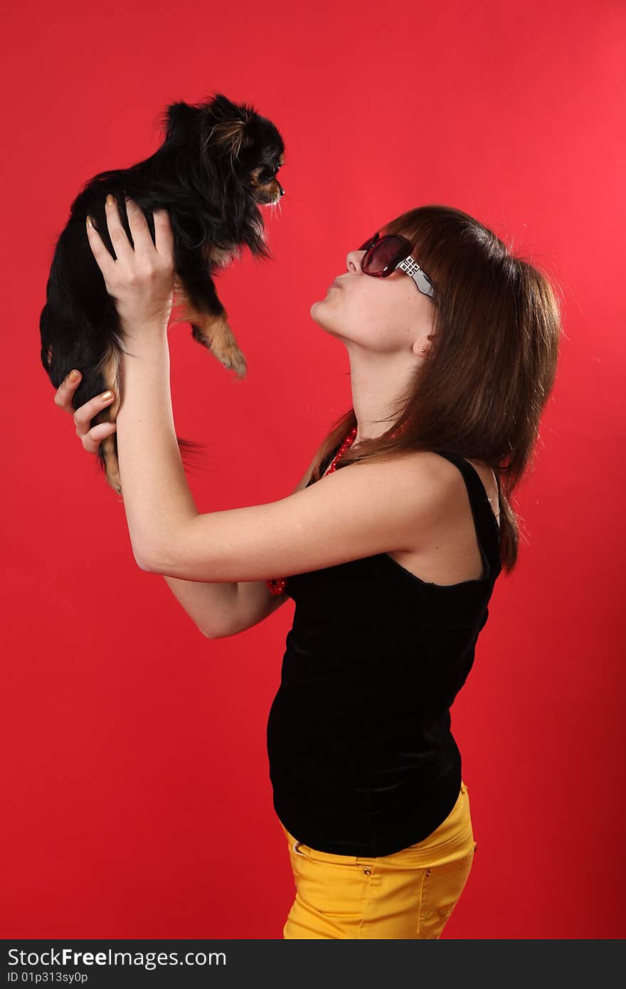 The young girl on a red background. The young girl on a red background