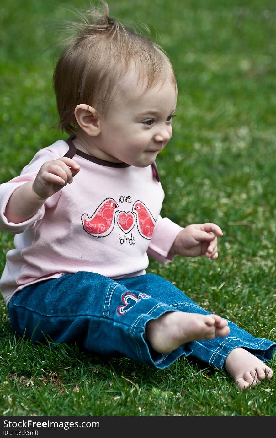 Little girl feeling the wind in her hair. Little girl feeling the wind in her hair