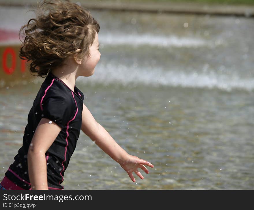 Playing in spray park.