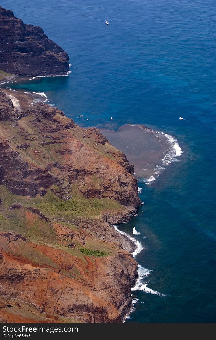 Looking down on the hawaiian coastline, shot from above shot from a helicopter above kaua'i