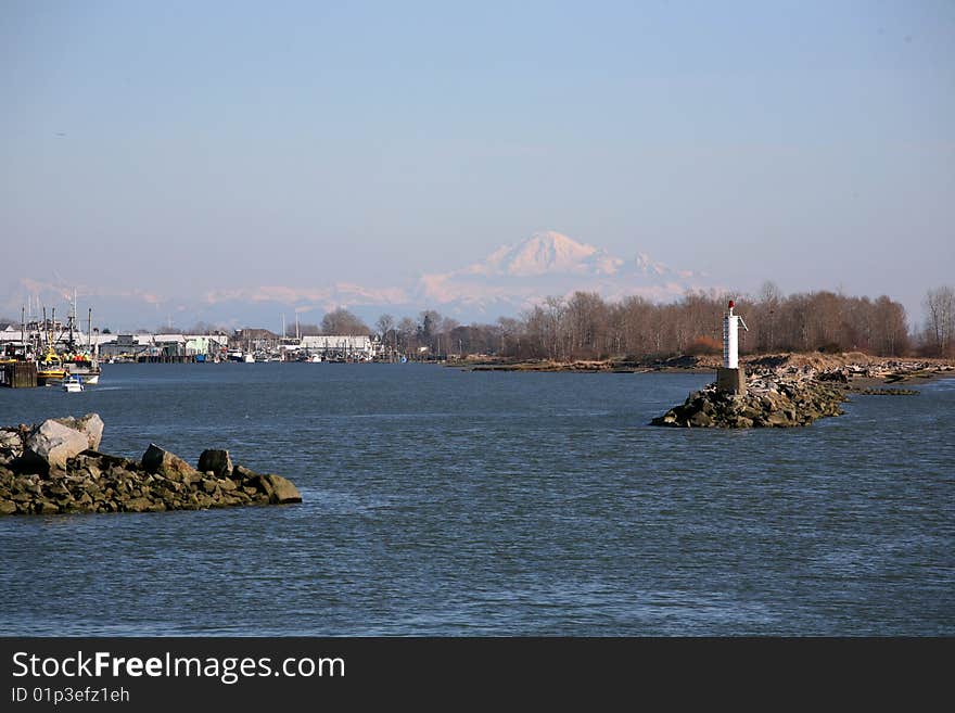 Fishman wharf with snow mountain background, richmond, british columbia. Fishman wharf with snow mountain background, richmond, british columbia