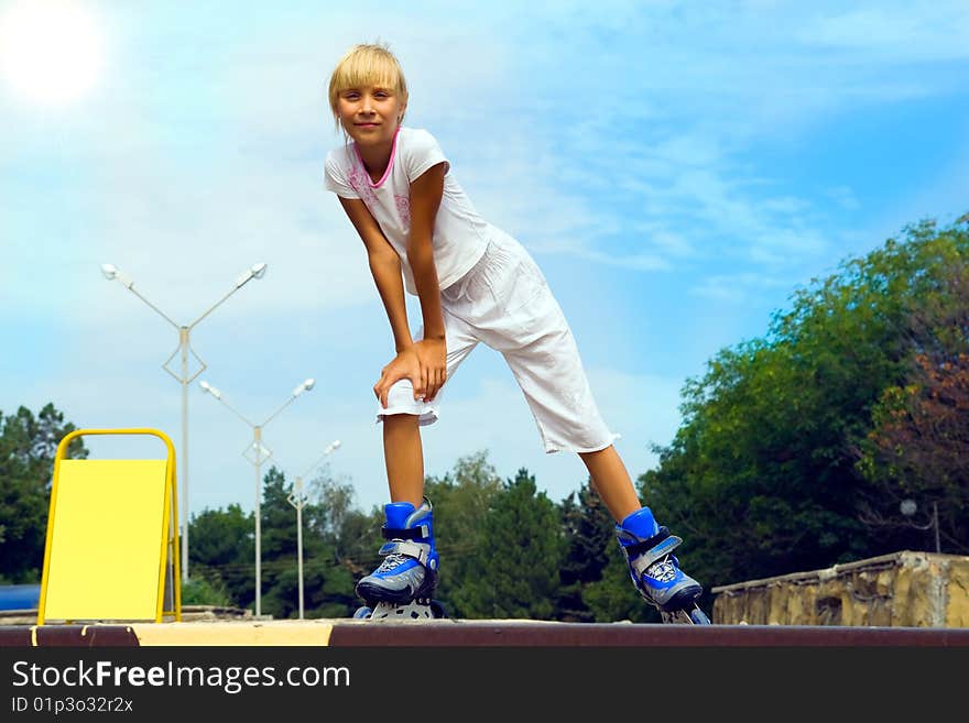 Little girl on roller skates. Little girl on roller skates.