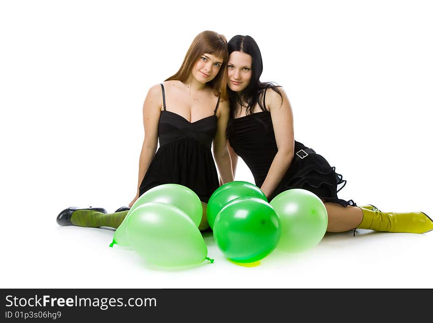 Two young girls with green balloons. Isolated on white background. Two young girls with green balloons. Isolated on white background