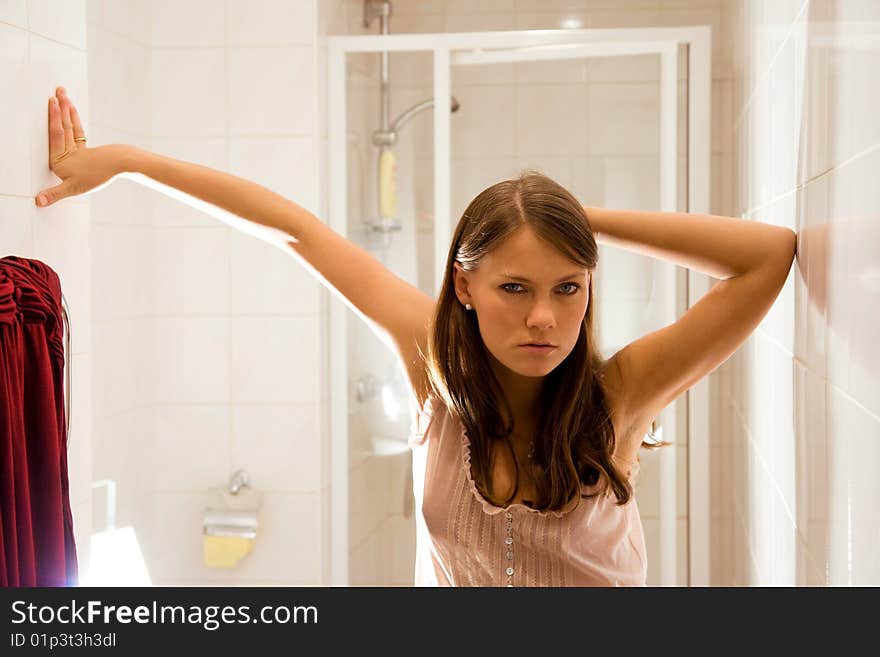 Young brunette woman in bathroom. Young brunette woman in bathroom