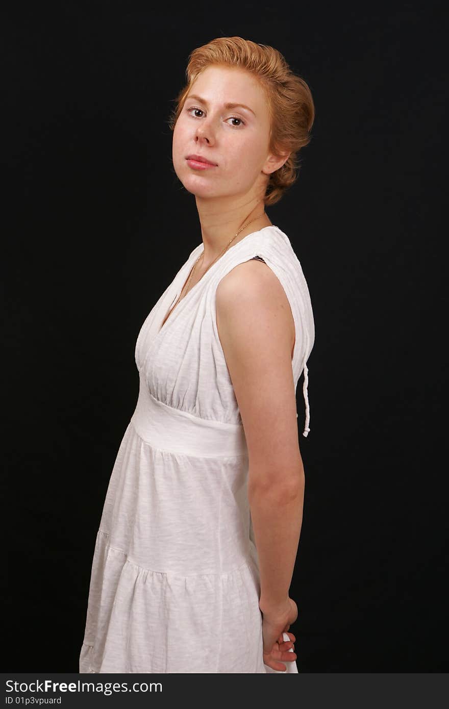 Red-haired woman in white dress