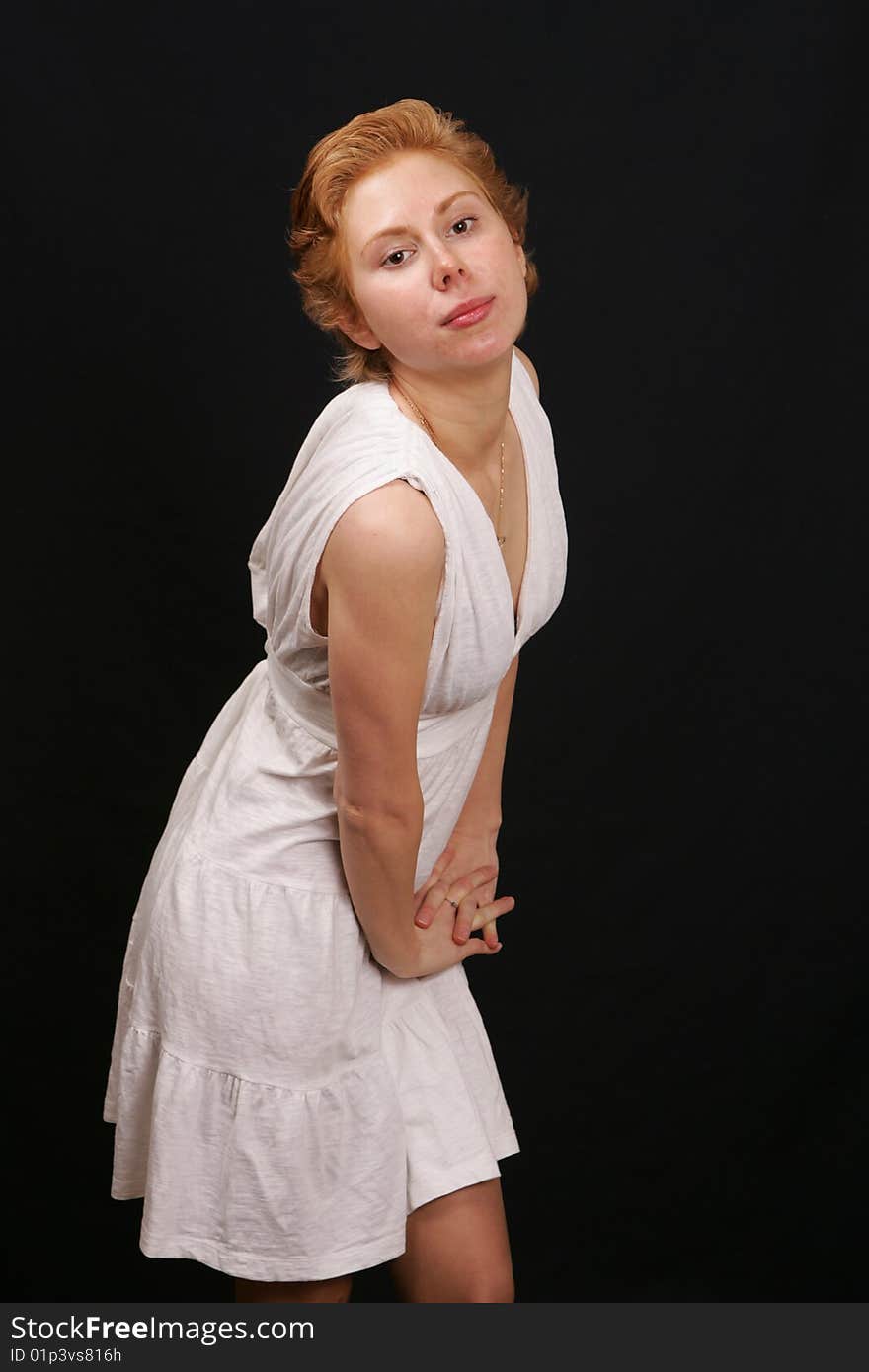 Red-haired woman in white dress