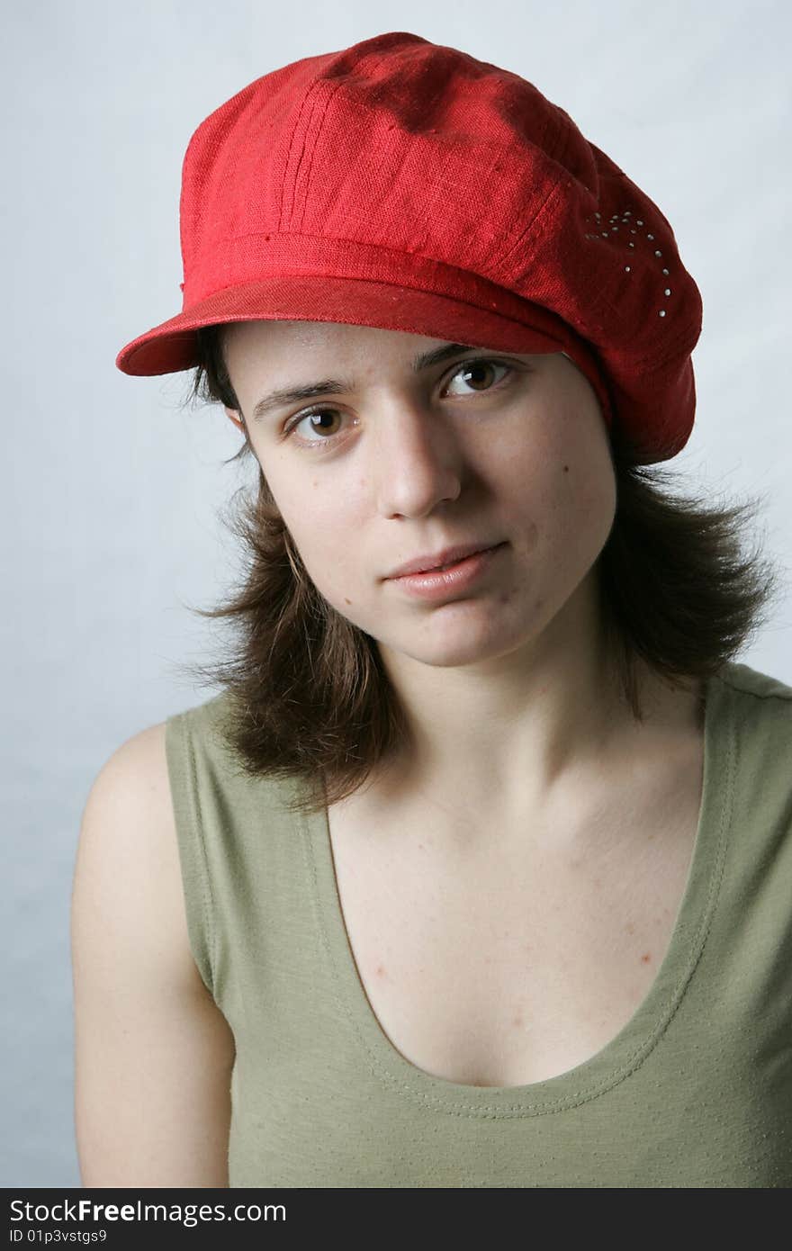 Portrait of a young girl in red cap