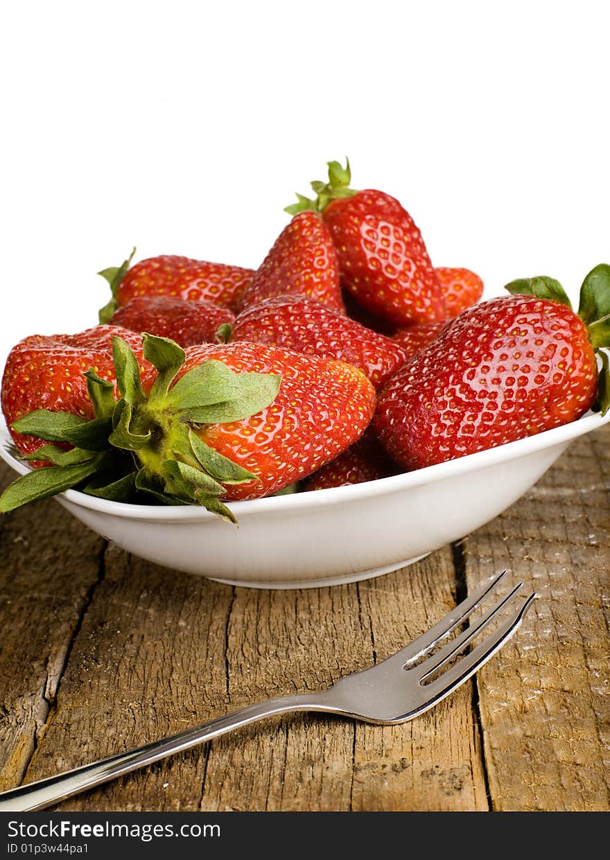 Fresh strawberries on a white plate with white background. Fresh strawberries on a white plate with white background