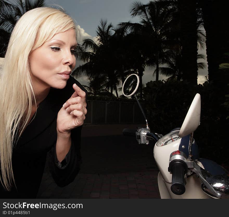 Woman checking her makeup