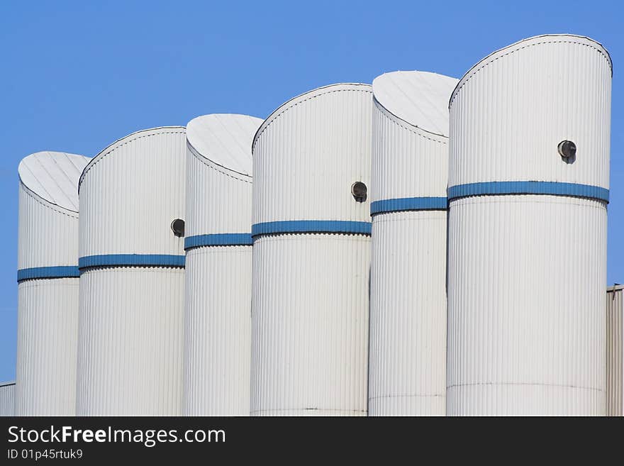 White cisterns and blue sky