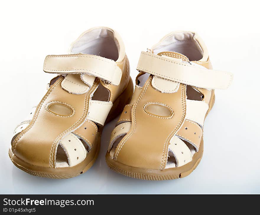 White children's barefoot persons on a white background. White children's barefoot persons on a white background