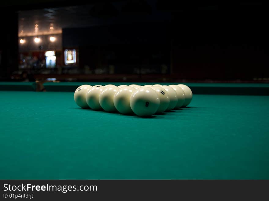 Pyramid of billiards balls on green table. Pyramid of billiards balls on green table