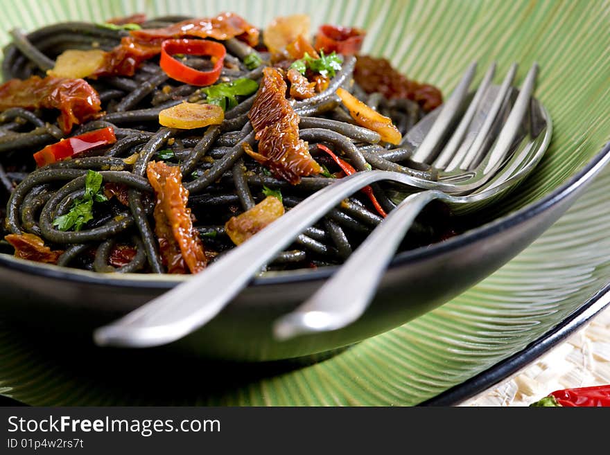 Spaghetti with chilli and dried tomatoes. Spaghetti with chilli and dried tomatoes