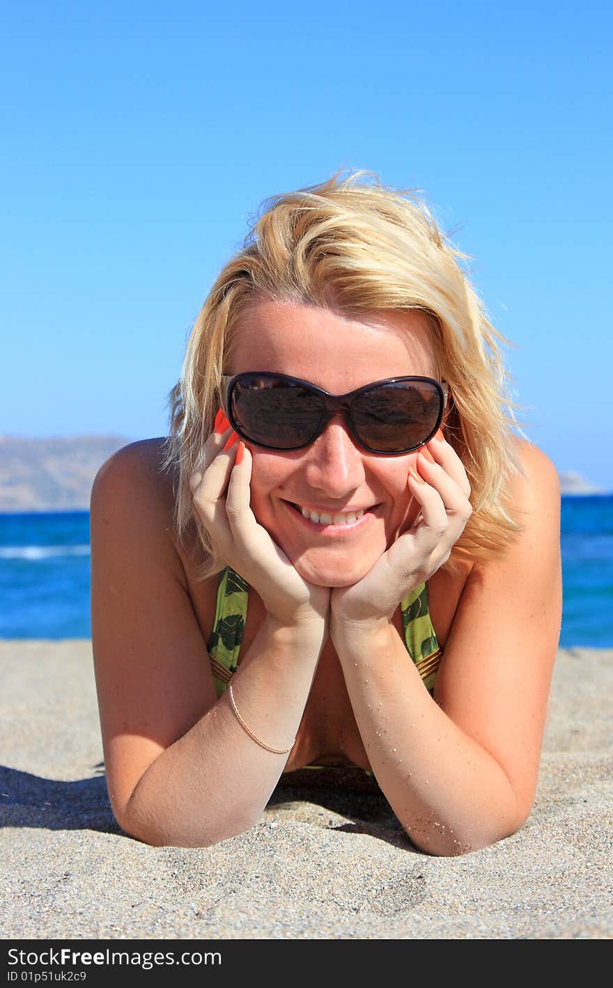 Beautiful girl  on beach at sea