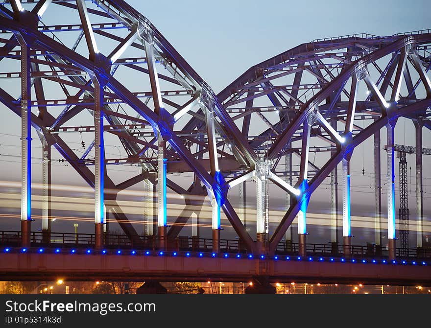 The morning express train on the bridge across Daugava river. The morning express train on the bridge across Daugava river.