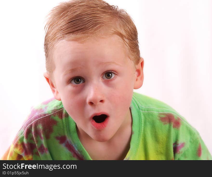 Portrait of young boy with surprised expression on face. Portrait of young boy with surprised expression on face