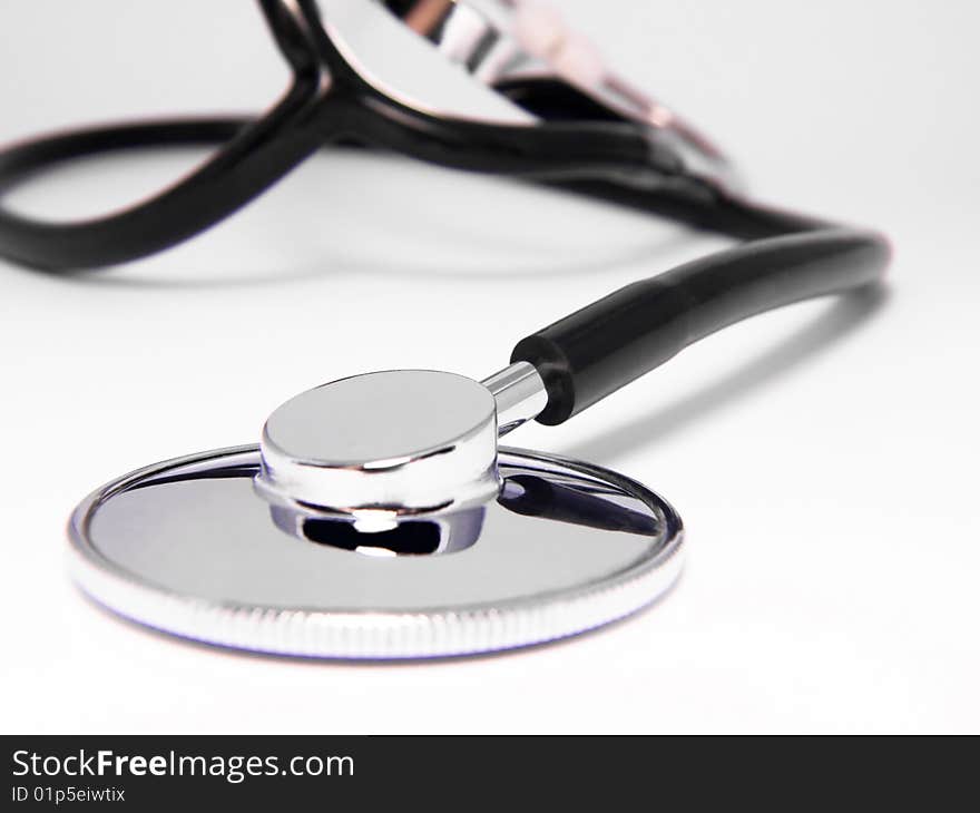 Medical stethoscope close-up on white background