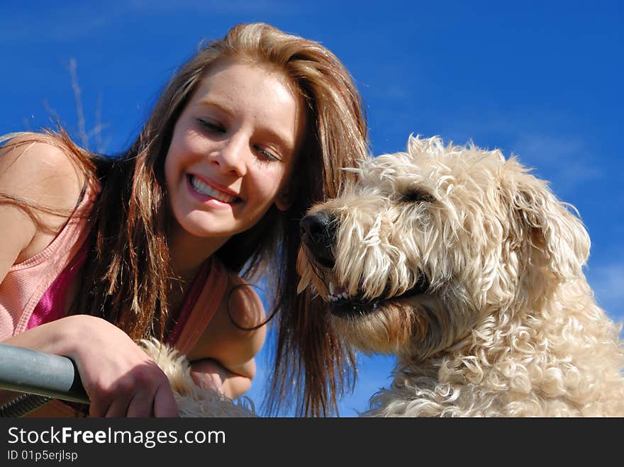 Teenager with her wheaten terrier dog. Teenager with her wheaten terrier dog