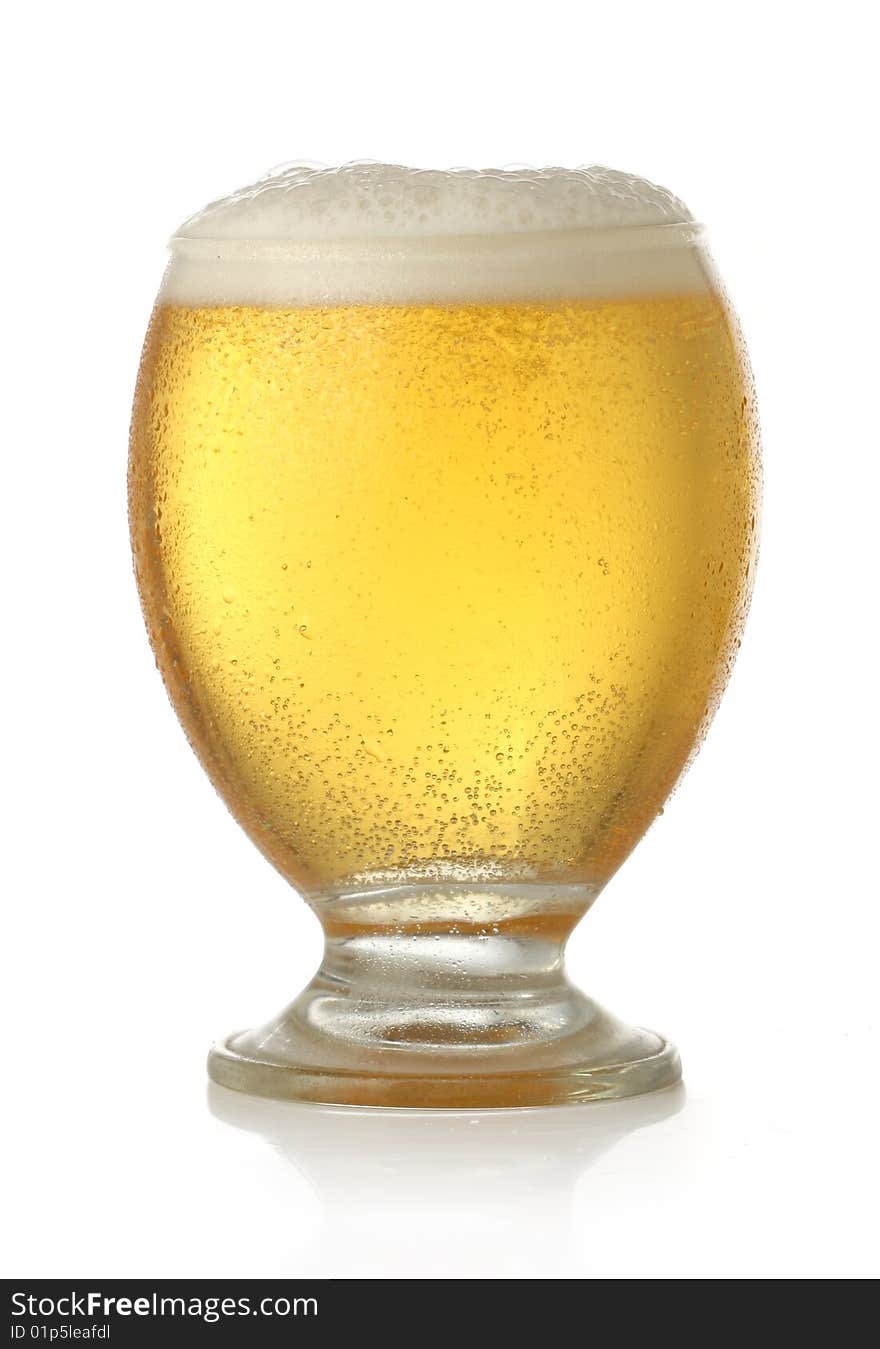 Glass of cold and fresh golden beer