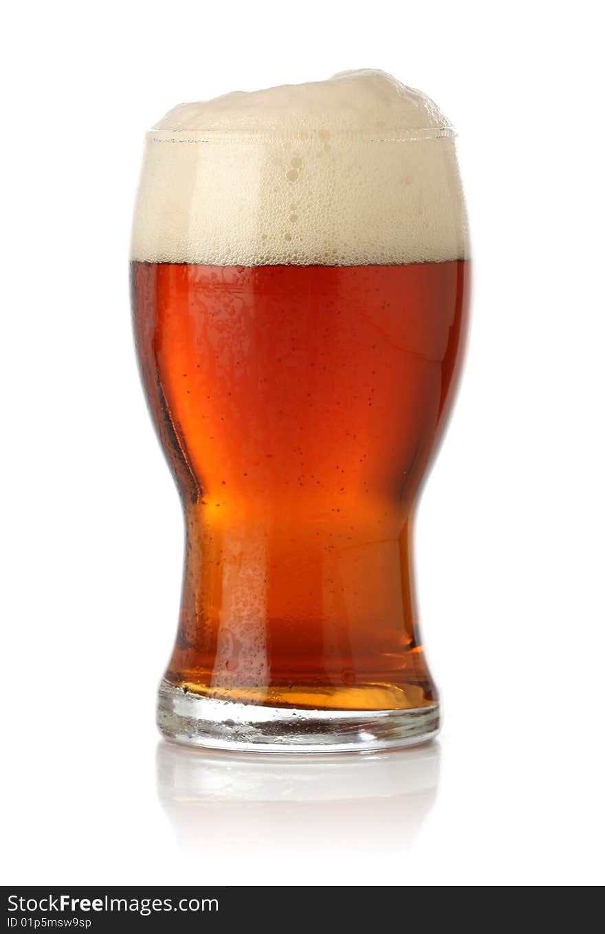 Cold glass of beer over white background