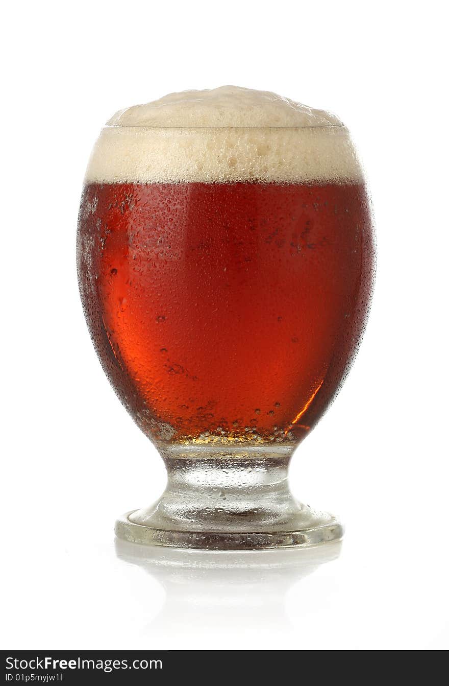 Cold glass of beer over white background