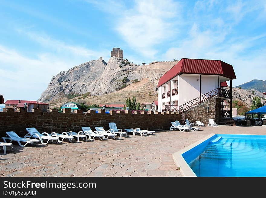 Recreation at hotel by the sea (Crimea, Ukraine) � photo with the mountain and castle in background. Recreation at hotel by the sea (Crimea, Ukraine) � photo with the mountain and castle in background