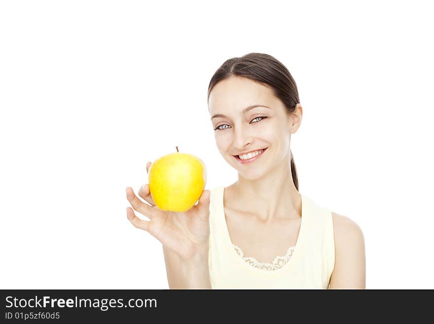 Young happy woman holding yellow apple isolated over white background