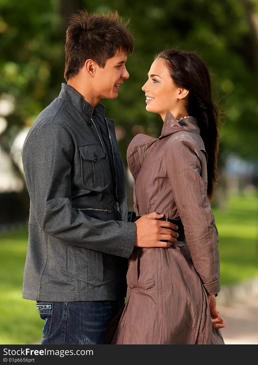 Young, happy couple on a walk in the park. Young, happy couple on a walk in the park